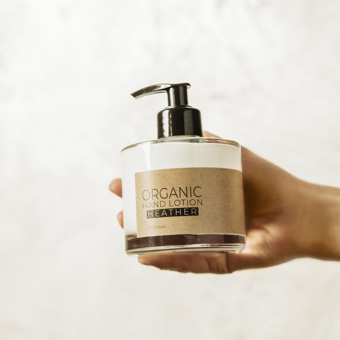 Heather organic hand lotion in glass bottle