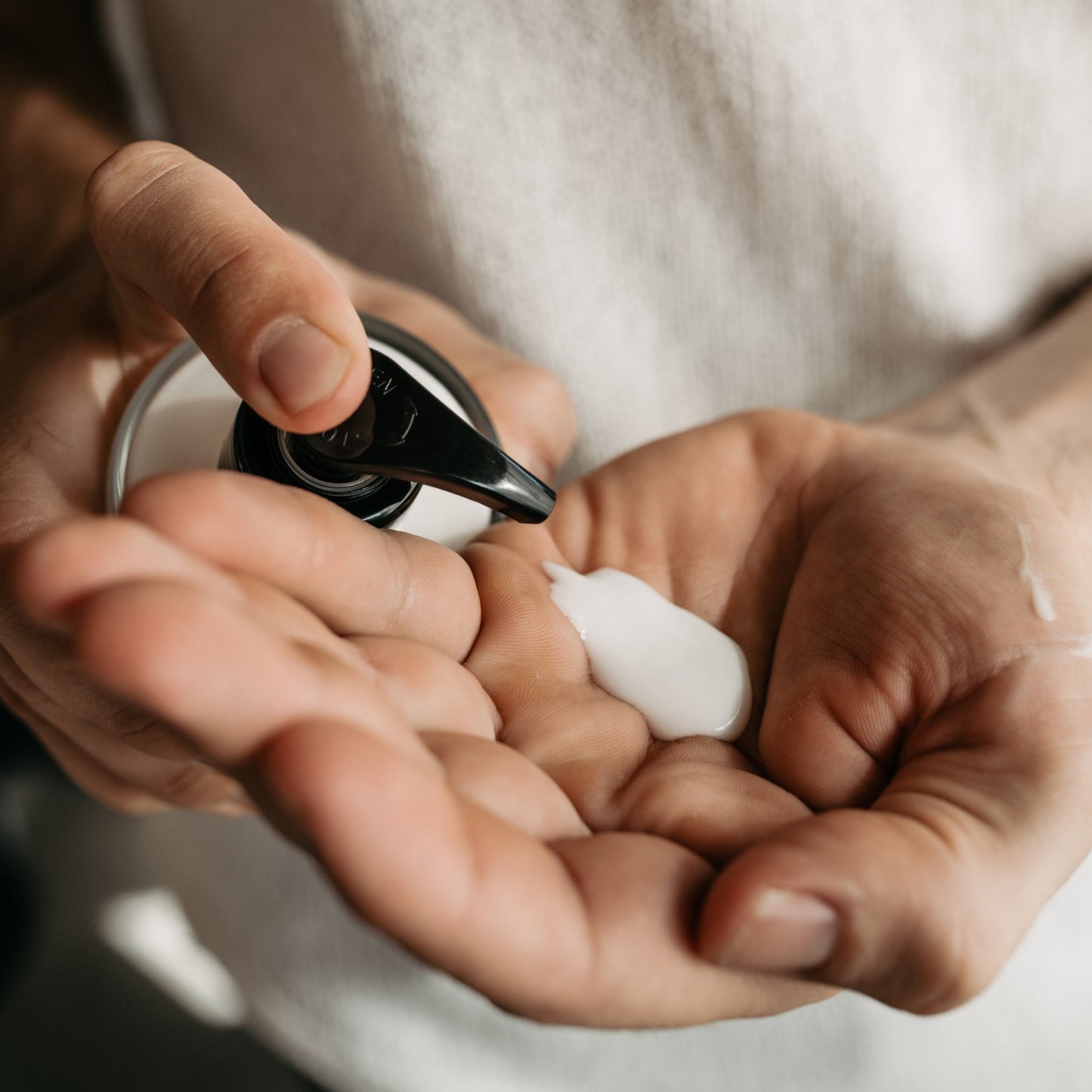 Moss organic hand lotion in glass bottle