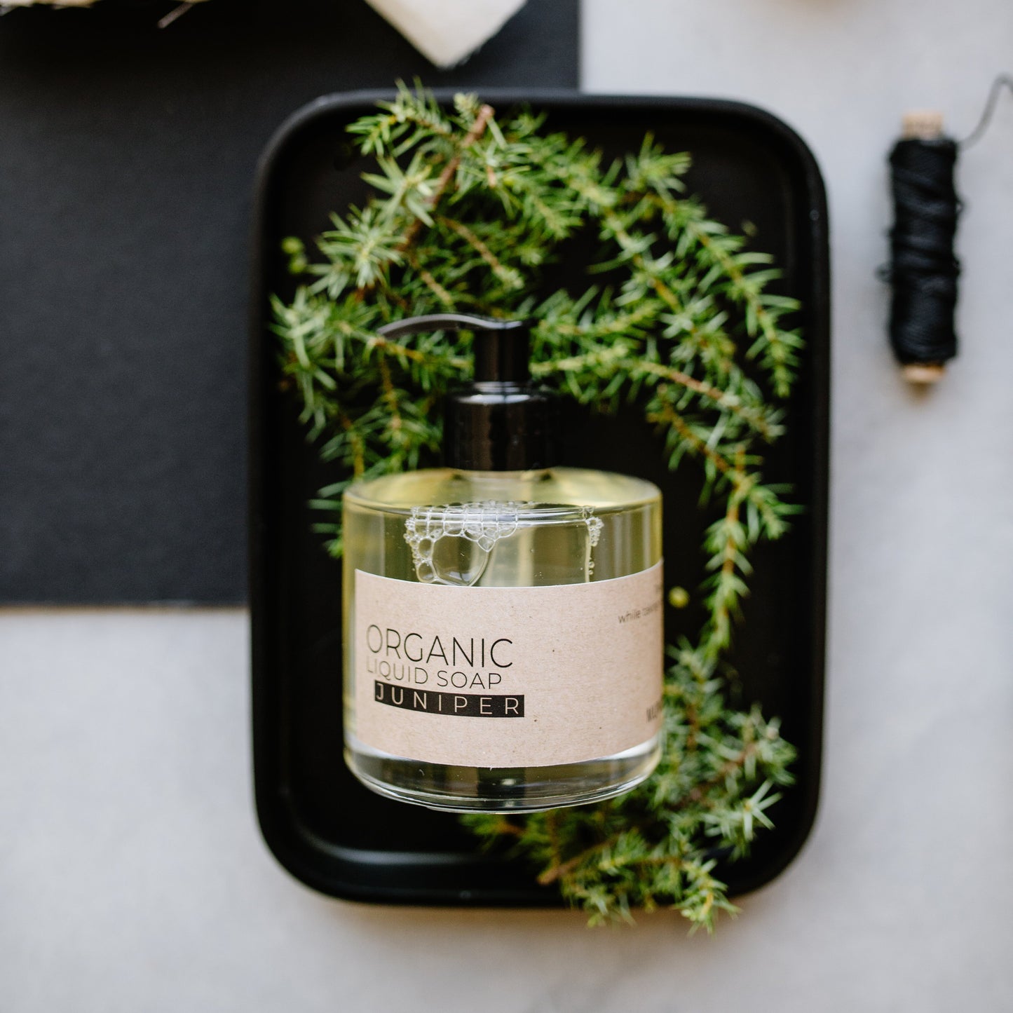 Juniper organic liquid soap in glass bottle