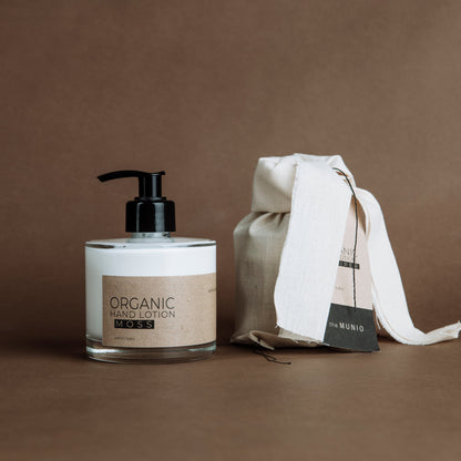 Moss organic hand lotion in glass bottle